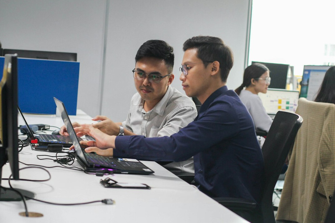 corporate team reviewing code