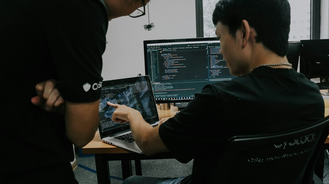 corporate team discussing code
